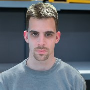 Dark-haired man with a mustache and goatee